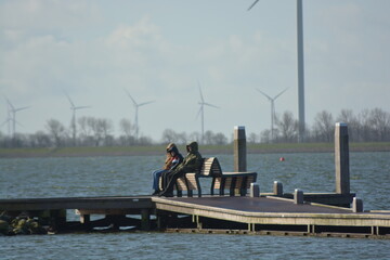 Fototapeta na wymiar North sea Amstelmeer industrial shore. A view from Lutjestrand, Netherlands. 