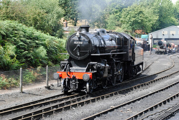 Fototapeta na wymiar Steam Locomotive Leaving Siding of Old Heritage Railway 