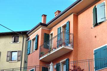 Fototapeta na wymiar View of Balcony on Painted Apartment Building 