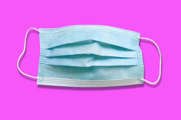 Medical mask. Disposable medical surgical mask. Protection against respiratory infections. Isolate on magenta background. Health care and medical concept
