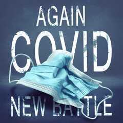 Lettering Again Covid New Battle and crumpled medical mask. The return of the coronavirus. New jump...