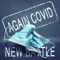 Inscription Again Covid New Battle and crumpled medical mask. Return of the coronavirus. New jump...