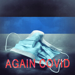 Lettering Again Covid and a crumpled medical mask on the flag of Estonia. Return of the...