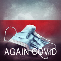 Inscription Again Covid and a crumpled medical mask on the flag of Poland. Return of the...