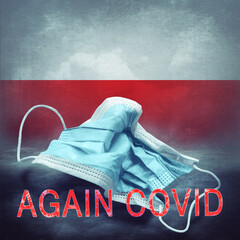 Lettering Again Covid and a crumpled medical mask on the flag of Poland. Return of the coronavirus....