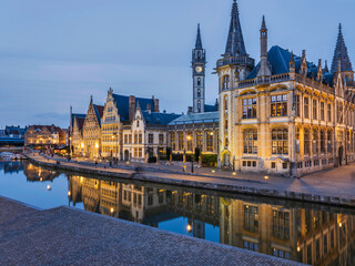 Fototapeta premium Historic medieval building at dusk on Leie river in Ghent, Belgium