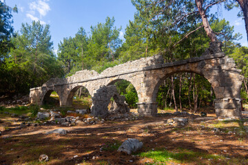 Fototapeta na wymiar Ruined aquaeduct of Phaselis, Greco-Roman ancient town in Antalya Province, Turkey.