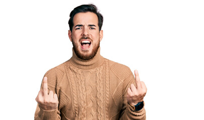 Young hispanic man wearing casual clothes showing middle finger doing fuck you bad expression,...