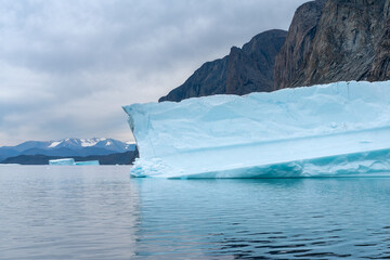 Big blue icebergs floating in the sea by Broughton Island, Nunavut, Canada. Boat ride from Inuit...