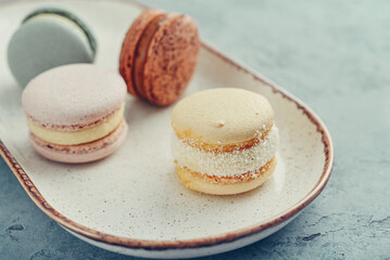 Colorful french macarons on plate