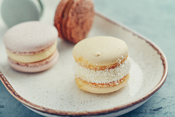 Colorful french macarons on plate