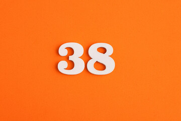 Number 38 - On orange foam rubber background