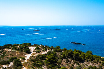 Fototapeta na wymiar Ibiza, spain - July 25, 2022: Ships leave the seaport of Ibiza in the direction of Formentera