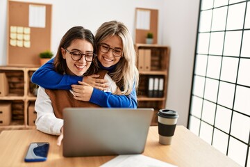 Two business workers woman smiling happy working at the office.