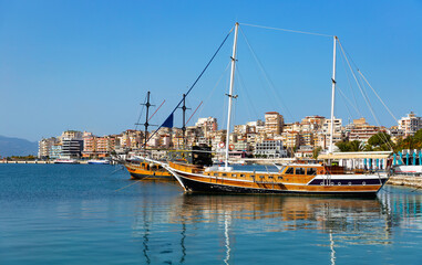 Sailing ships on seashore near Saranda in Republic of Albania.