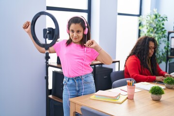 Mother and daughter working and recording dance video at office