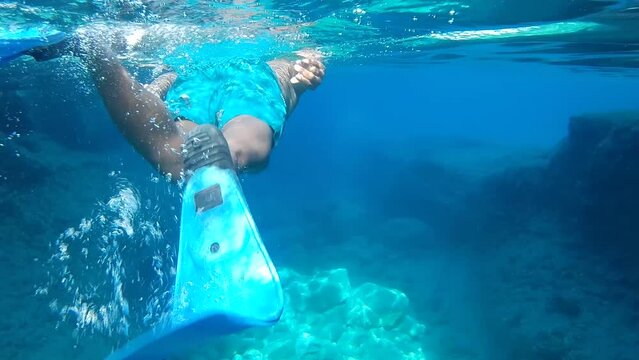 black man snorkeling in the sea