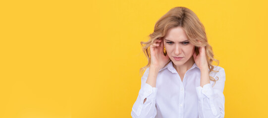 Woman isolated face portrait, banner with mock up copy space. It is painful. Unhappy girl has pain in ears. Suffering from earache. Ear pain. headache.