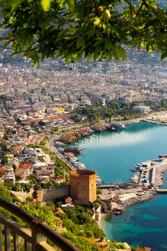 Picturesque city view of Alanya and historical Red Tower Kizil Kule at Mediterranean coast, Turkiye
