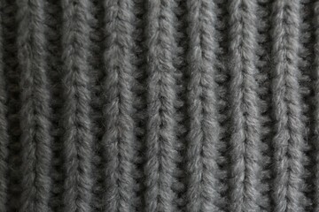 Beautiful grey knitted fabric as background, top view