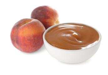 Peach puree in bowl and fresh fruits on white background