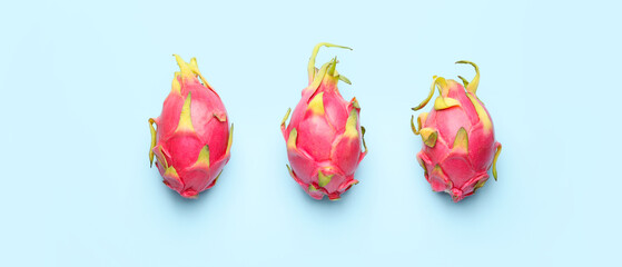 Tasty dragon fruit on light blue background