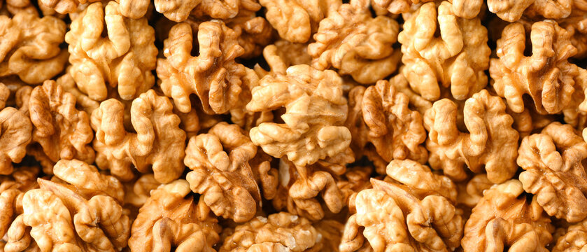 Many tasty walnuts as background, top view