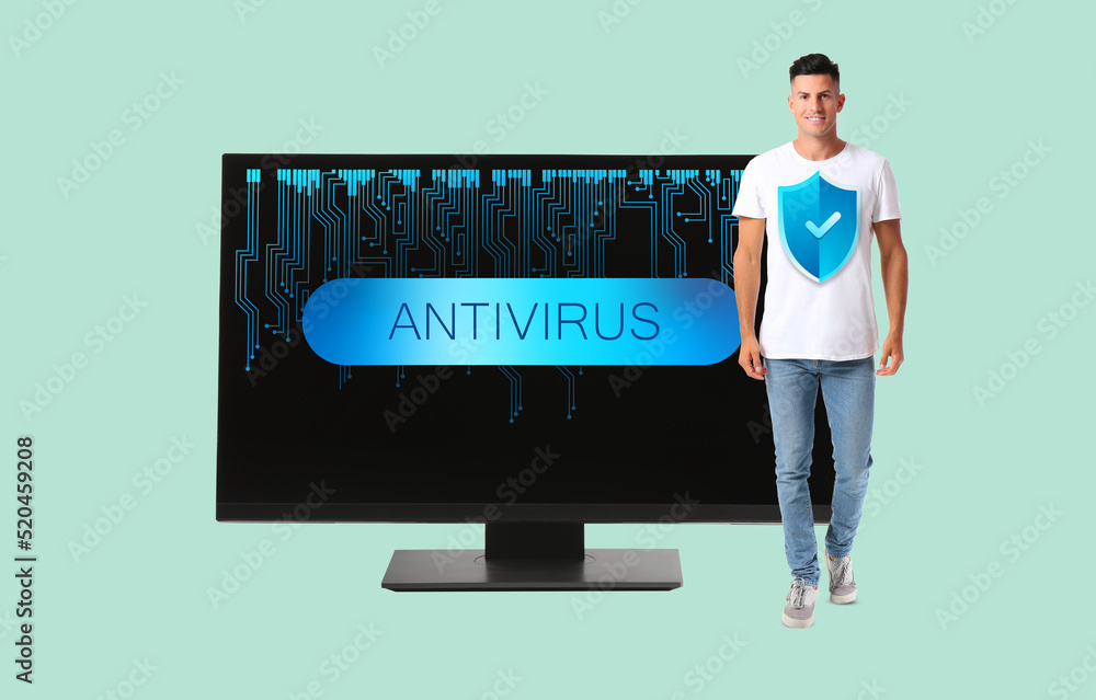 Poster man with icon of antivirus and big computer monitor on color background
