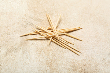 Heap of toothpicks on light background