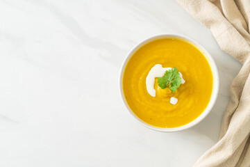 pumpkin soup in white bowl