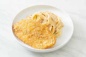 fettuccine pasta white cream sauce with fried fish