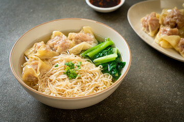 egg noodles with pork wonton soup or pork dumplings soup and vegetable