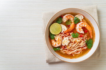 instant noodles ramen in spicy soup with shrimps (Tom Yum Kung)