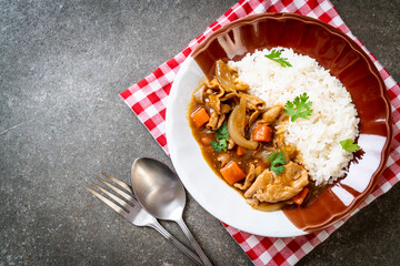 Japanese curry rice with sliced pork, carrot and onions