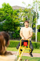 Asian couple love play seesaw