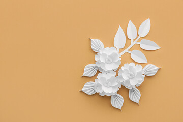 Composition with origami flowers and leaves on color background