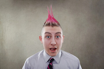 Surprised teen with a pink mohawk haircut