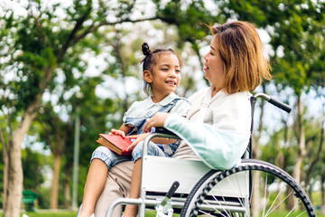 Portrait of happy love asian grandmother and asian little cute girl enjoy relax in summer park.Young girl with their laughing grandparents smiling together.Family and togetherness