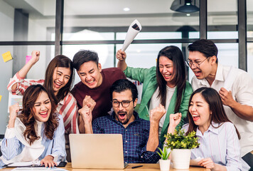 Group of asian business meeting and discussing strategy startup project analysis finance process.Success business people work plan and brainstorm marketing idea with laptop in office.Teamwork