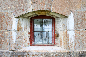 Windows and stone wall detail on historic building in the Oscarsborg Fortress, historic WW2 site in Norway
