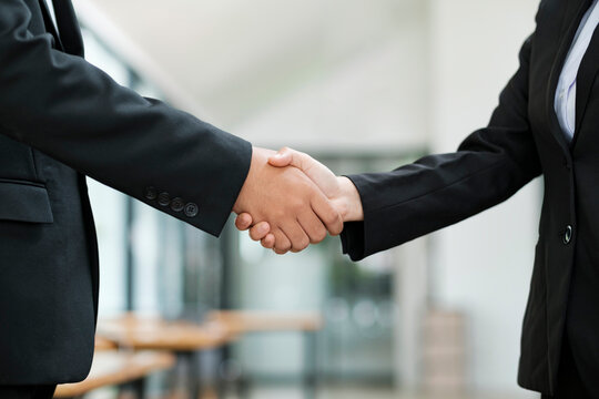 Businessman teamwork handshake.
