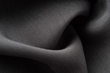 Macro photography of silk gray fabric, texture. Luxurious dark sewing background. Beautiful shiny...