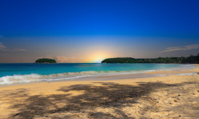 Colourful Skies Sunset over Kata Beach in Phuket Thailand. This Lovely island waters are turquoise blue waters, lush green mountains colourful skies and beautiful views of Pa Tong Patong