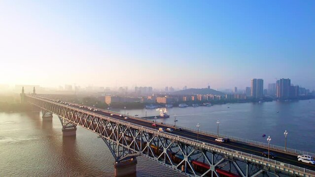 Follow-up photography of trains and ships traveling on the Nanjing Yangtze River Bridge in Jiangsu, China
