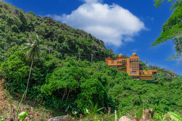 Fototapeta premium Phuket Mountains over looking Karon Beach lovely Skies Sunset over Patong Pa Tong Beach in Phuket island Thailand. Lovely lush green mountains colourful skies