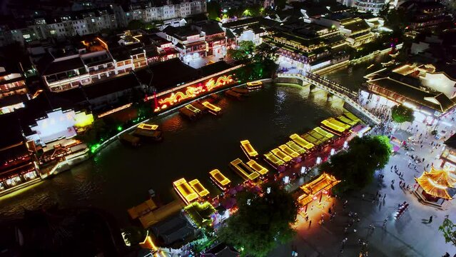 Aerial view of cruise ship and tourists on Qinhuai River in Nanjing, Jiangsu, China at night