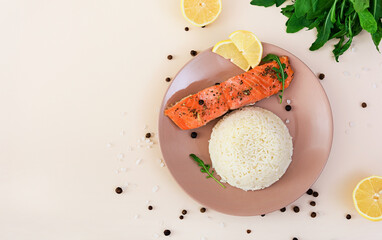 Baked salmon with spices and rice. Top view