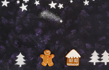 Christmas gingerbread cookies on dark background