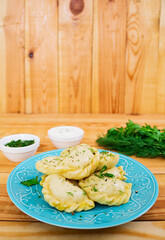Delicious dumplings with cabbage on wooden background