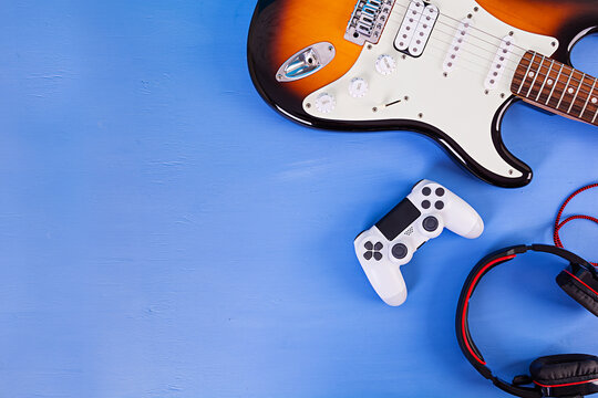 Electric Guitar, Joystick, Headphones. Pop Culture Media Attributes. Top View.